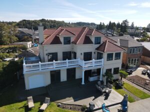 How often should you wash your house in washington's damp climate?