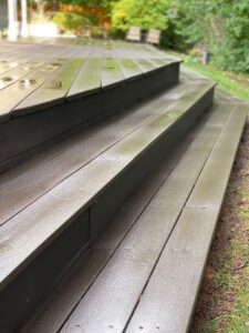 Deck cleaning before summer removing algae buildup